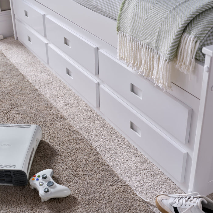 Close-up of a closed drawer front on the Nova White Wooden 6 Drawer Bed