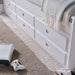 Close-up of a closed drawer front on the Nova White Wooden 6 Drawer Bed