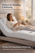 Woman reading in bed on a Visco Therapy mattress with the adjustable bed head raised