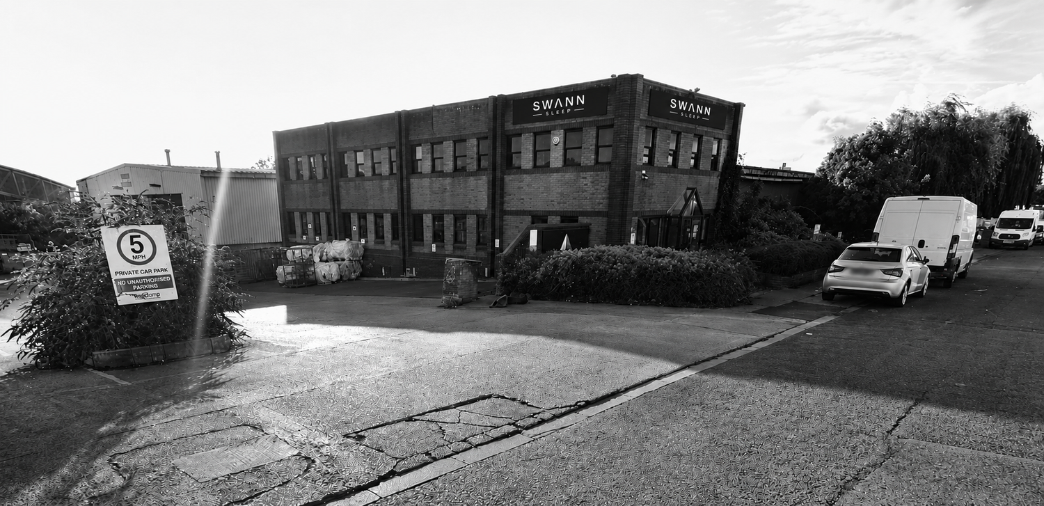 Exterior of the Swann Sleep mattress factory in Bristol, showing the company signage above the entrance